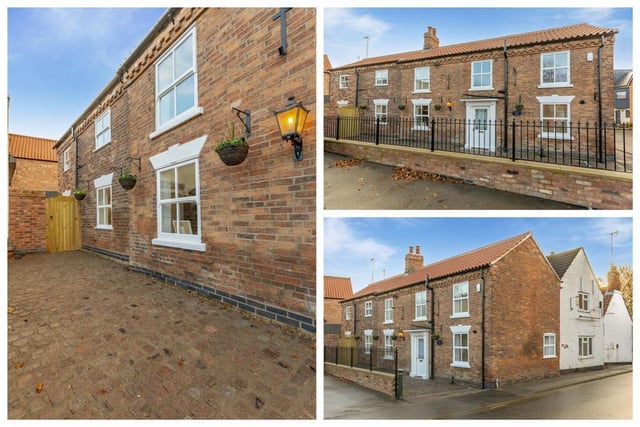 These photos show the Edwinstowe cottage's lovely Victorian setting. At the front is a stunning cobbled path, with cobbles reclaimed from the local pumping station, and bespoke railings.