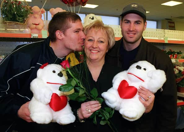 Sheffield Steelers players Shawn Silver, left and team mate Jason Weaver with Mal Ferris, centre at Asda at Chapletown for Valentine's Day 2000