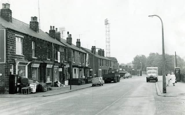 Leppings Lane, Hillsborough, in 1963 with the Sheffield Wednesday floodlights towering over the terraced houses and shops.
