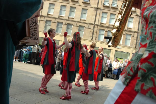 Dance group Lizzie Dripping perform outside Sheffield  Town Hall to celebrate St George's Day.