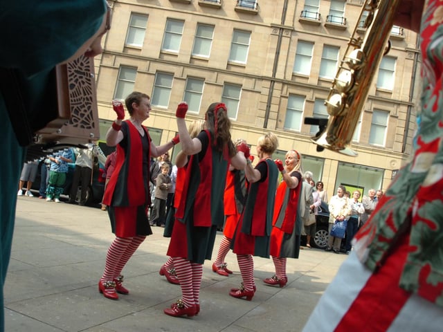 Dance group Lizzie Dripping perform outside Sheffield  Town Hall to celebrate St George's Day.