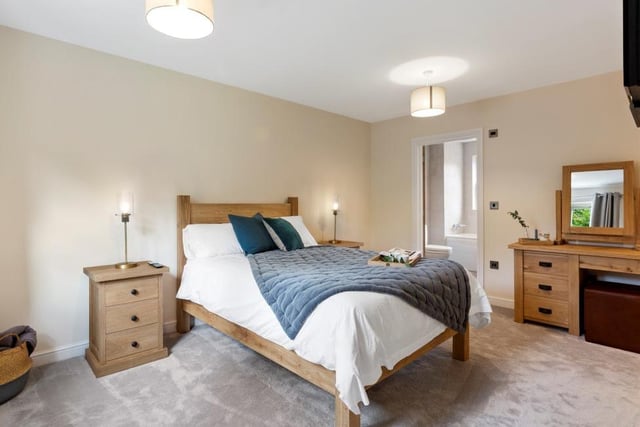 How could you not sleep tight in a bedroom as comfortable as this? The door leads to its en suite facilities. The other two bedrooms are on the second floor of the property, which also includes a high-quality shower room.