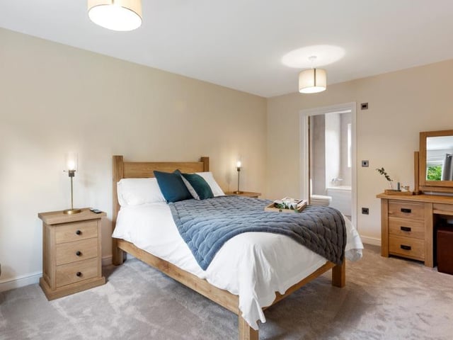 How could you not sleep tight in a bedroom as comfortable as this? The door leads to its en suite facilities. The other two bedrooms are on the second floor of the property, which also includes a high-quality shower room.