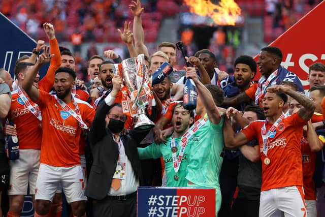 Former Sheffield Wednesday men Jordan Thorniley and Gary Madine were among the Blackpool players celebrating promotion to the Championship yesterday.