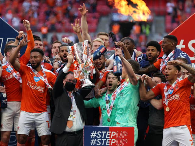 Former Sheffield Wednesday men Jordan Thorniley and Gary Madine were among the Blackpool players celebrating promotion to the Championship yesterday.