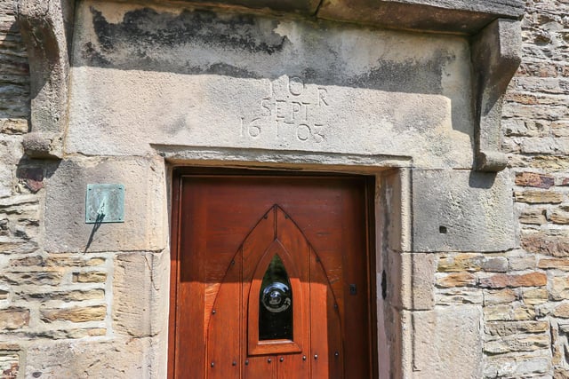 Over the door is the date September 16, 1703.