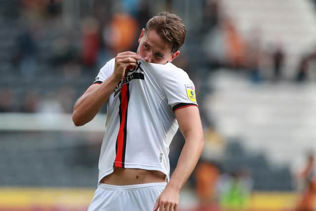 Sander Berge kisses the Sheffield United badge after helping to seal victory over Hull City on Sunday: Simon Bellis / Sportimage