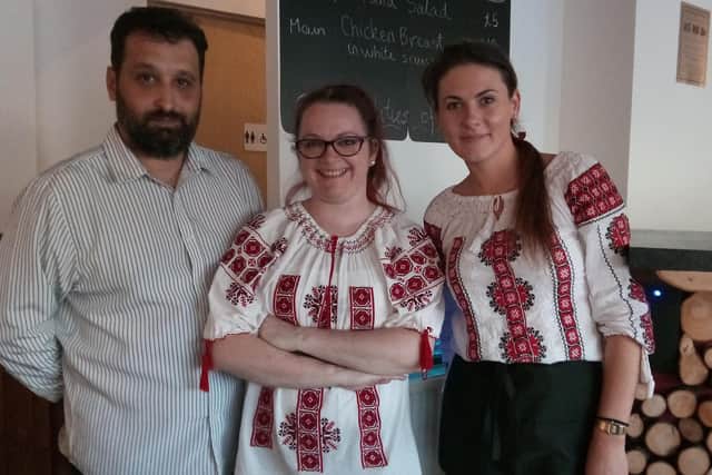 Owners of La Vlad: Adrian Briciu and Camelia Colnic with waitress Roxana.