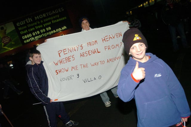 Pictured with a message for Arsenal are Rovers fans (l-r) Scott Grayson, 18, of Armthorpe, Peter Suter, of Rossington and Dylan Chapman, nine, of Armthorpe.