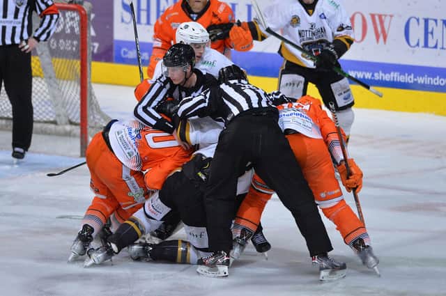 Tussle between Steelers and Panthers players.