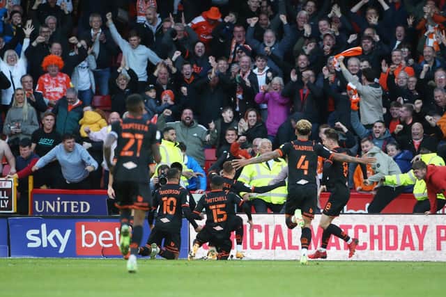Blackpool players and fans celebrate their winner against Sheffield United: Alistair Langham / Sportimage