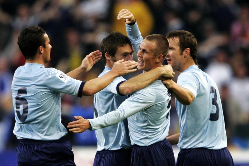Kenny Miller celebrates scoring his first goal with team mates and captain Barry Ferguson during the World Cup qualifier against Norway at the Ullevaal Stadium in Oslo.