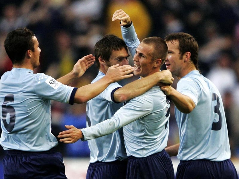 Kenny Miller celebrates scoring his first goal with team mates and captain Barry Ferguson during the World Cup qualifier against Norway at the Ullevaal Stadium in Oslo.