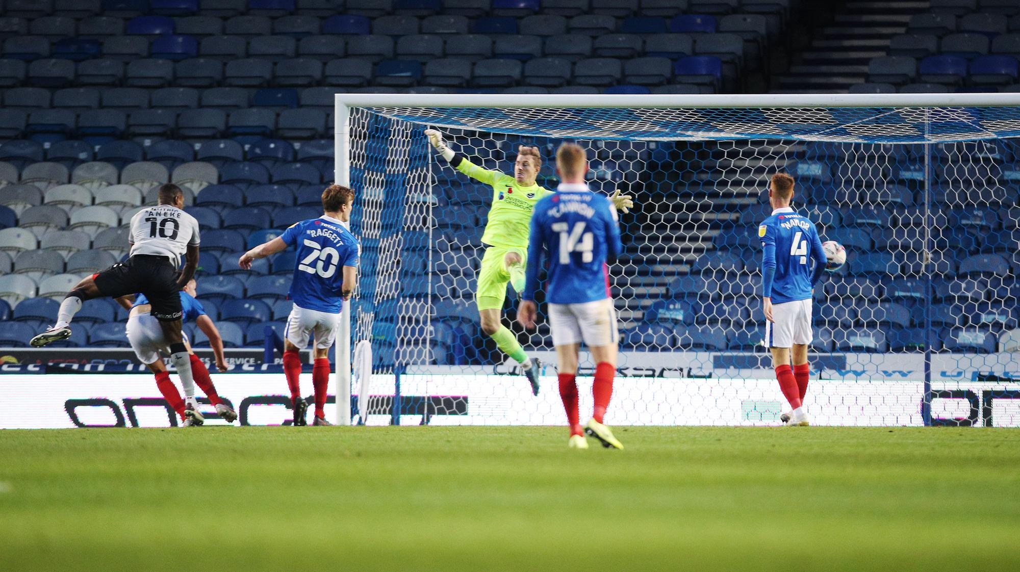 Charlton's Chuks Aneke scores his first goal of the match passed Portsmouth's Craig MacGillivray