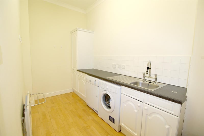 The utility room, measuring 3.91m by 1.91m, features a sink and fitted units.