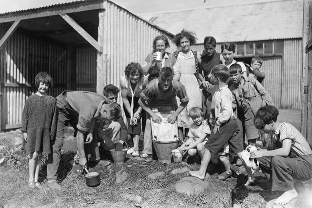 Children and young people cleaning their dishes at Welton, Blairgowrie.  Perth Museum and Art Gallery, D Wilson Laing Collection. Copyright Perth & Kinross Council.