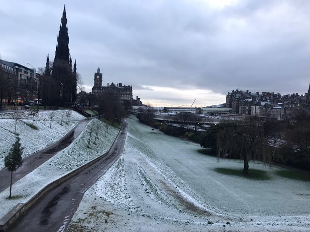 Meanwhile, in the shadow of the Castle, the grass in Princes Street Gardens was covered in frost.