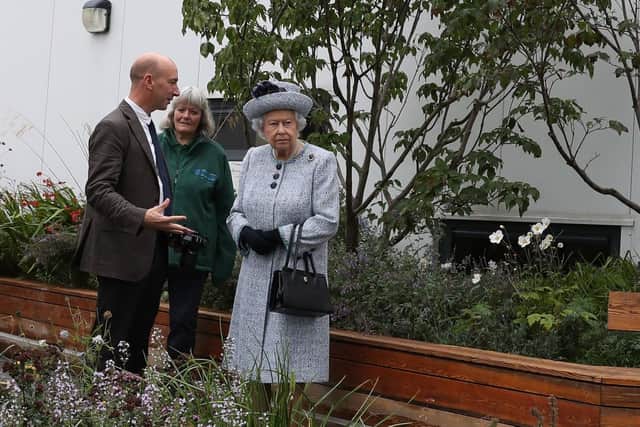 Queen Elizabeth II with Robertson Family Roof Garden designer Professor Nigel Dunnett, during a visit to Aberdeen Royal Infirmary to open the roof garden and meet patients and staff. PRESS ASSOCIATION Photo. Picture date: Friday September 29, 2017. The Royal Bank of Canada offered their entire gold medal-winning Chelsea Flower Show garden to NHS Grampian and it was adapted by designer Professor Nigel Dunnett so that wheelchairs and intensive care unit patients could make use of the area. See PA story ROYAL Queen. Photo credit should read: Andrew Milligan/PA Wire
