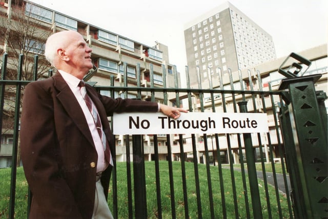 Charlie Pook at the fence surrounding Cannock Lawn in Somers Town in January 1993