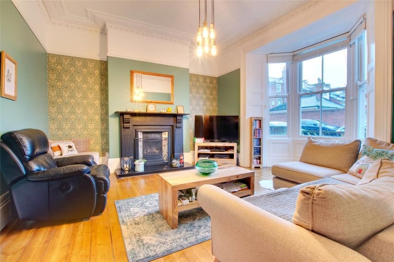 The open fire place in the living room is the perfect focal point of the home.

Photo: Rightmove