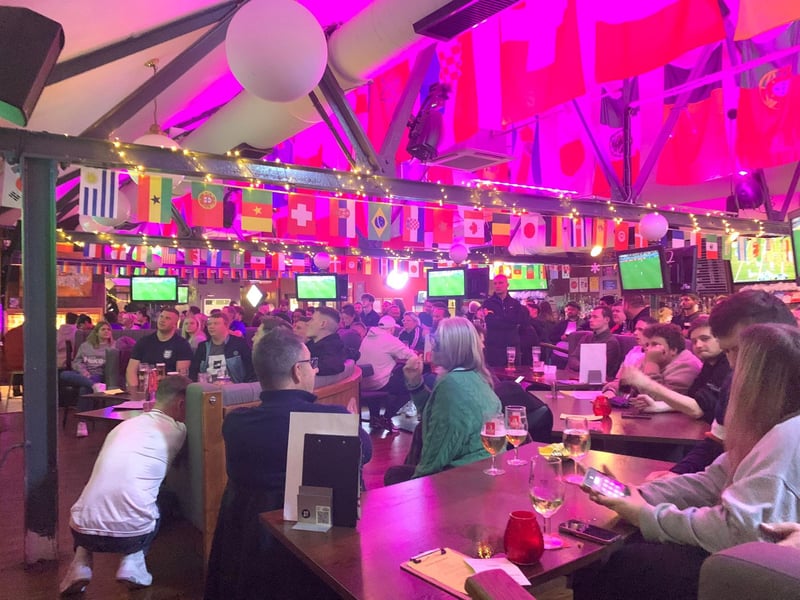 The Common Room, which also has pool tables, table tennis and shuffleboard is renowned for it's live sporting coverage. {ictured here is England fans in the pub during the 2022 World Cup celebrating the team's win over Senegal in the round-of-16.