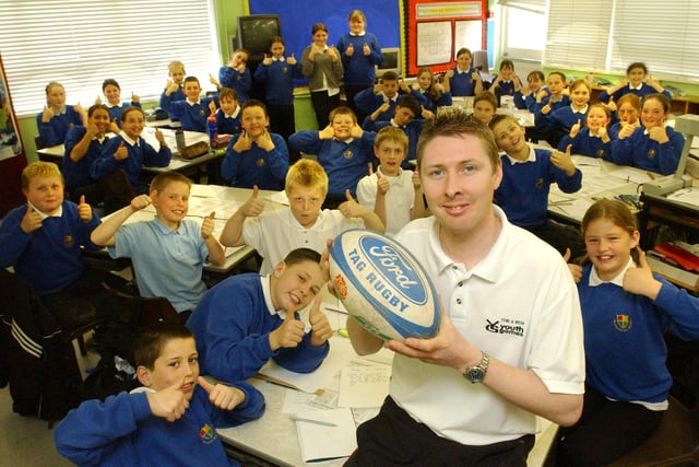 Peter Gulgrandsen was doing so well with his sporting work at St Oswald's RC Primary School in South Shields, that he was nominated for an award in 2004. Are you one of the students pictured with him?