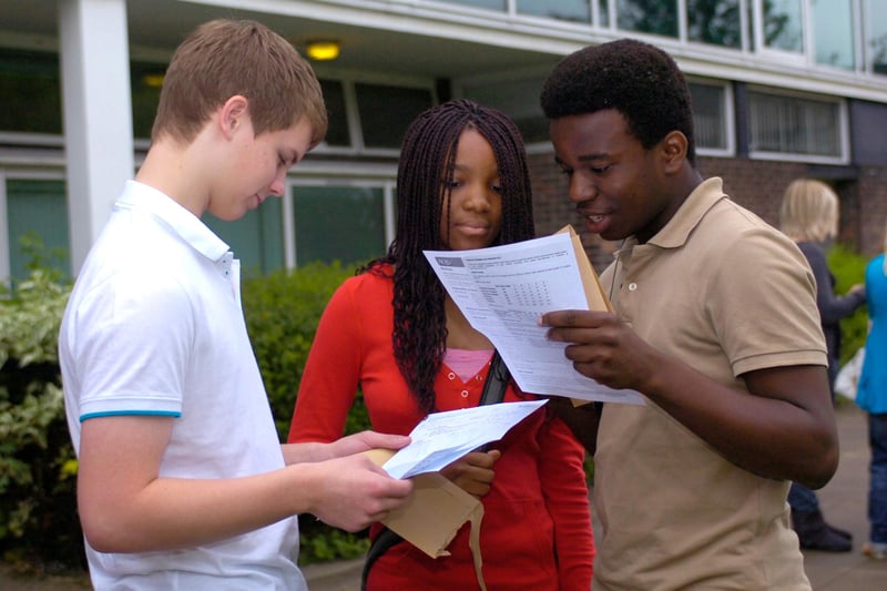 Pupils discuss their 2009 A-level results at All Saints RC High, Sheffield. From left, Nick Bell, Dami Alabi and Ayo Alabi