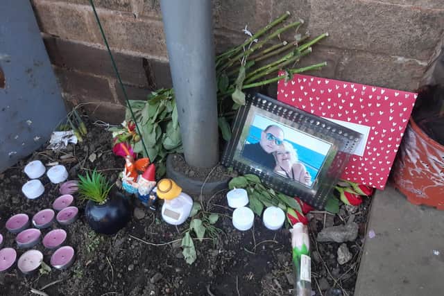 Floral tributes have been left outside the house in Stovin Gardens.