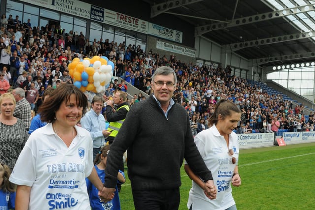 Ernie flanked by daughters Nikki and Sarah on the pitch in 2016.