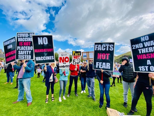 About 500 to 600 people are marching outside Holyrood, at the foot of Arthur's Seat, demonstrating against the use of masks and lockdown rules.