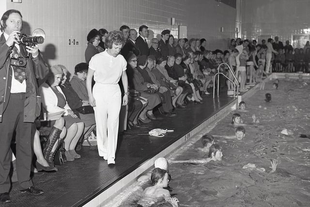 Princess Anne watches swimming demonstrations at the opening of Buxton's pool on 16th November 1972.