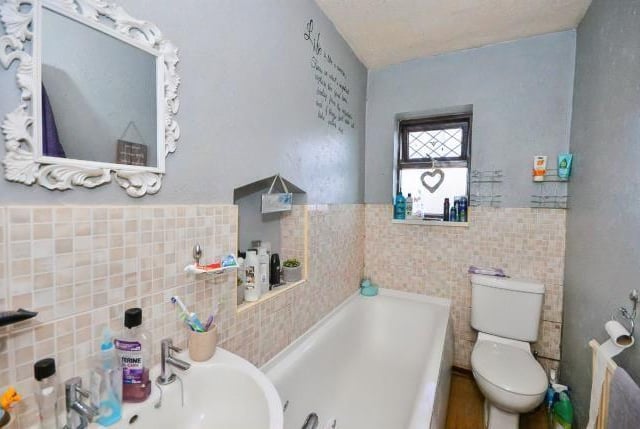 The house has a modern bathroom with nook.