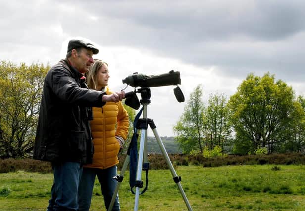 Sheffield and Rotherham Wildlife Trust BioBlitz on Wadsley Common: Wadsley and Loxley Commoner John Robinson birdwatching with daughter Sophie.