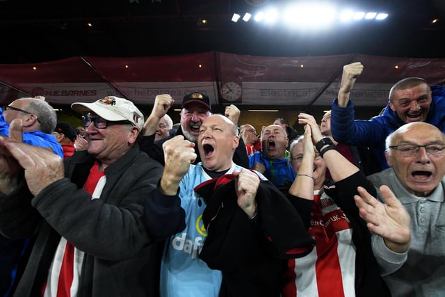 Sunderland fans celebrate their team's first goal during the Carabao Cup Third Round match between Sheffield United and Sunderland at Bramall Lane.