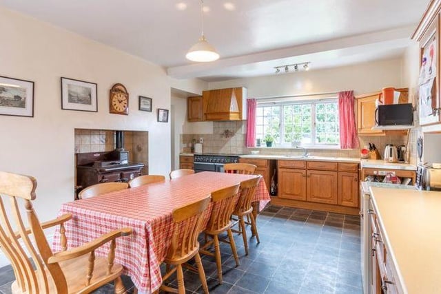 An extension to the property includes the heart of the home and this traditional, farmhouse-style kitchen. It has a wide range of wall and base units, an Aga, a range cooker and space for white goods.
