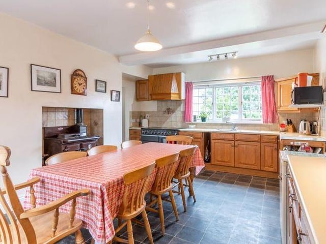 An extension to the property includes the heart of the home and this traditional, farmhouse-style kitchen. It has a wide range of wall and base units, an Aga, a range cooker and space for white goods.