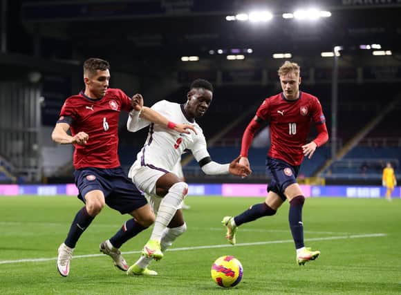 BURNLEY, ENGLAND - NOVEMBER 11: Folarin Balogun of England holds off Michal Fukala of Czech during the UEFA European Under-21 Championship Qualifier match between England U21s and Czech Republic U21s on November 11, 2021 in Burnley, England. (Photo by Lewis Storey/Getty Images)