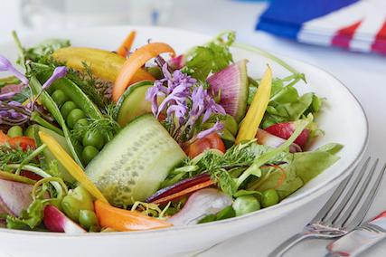 Allotment salad – makes 4 portions
Prep time – 20 minutes

Ingredients:
 150g fresh peas – podded, reserve 4 x pods of peas for garnish
 1 x Little Gem lettuce
 150g heritage carrot
 150g cucumber
 1 bunch breakfast radishes
 150g purple radishes
 150g watermelon radishes
 20g wild fennel
 30g Dijon mustard
 100ml virgin rape seed oil
 20ml cider vinegar
 Sea salt and freshly ground black pepper
Method:
 Thinly shave carrots, cucumber, watermelon and purple radishes.
 Remove outer leaves of breakfast radishes and stand in cold water.
 Prepare and wash the gem lettuce cutting into small pieces.
 For the dressing; place Dijon mustard and cider vinegar in blender and slowly add rapeseed
oil until emulsified, season to taste..
 Arrange vegetables in bowl, finish with a large spoon of dressing, the picked wild fennel,
unzipped pea pods and serve.