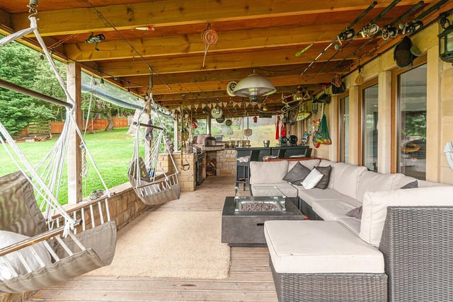 The loggia wraps around the outside of the property's swimming pool room. It features decked flooring, a pizza oven and space for a gas BBQ making it a fabulous outdoor entertaining space.