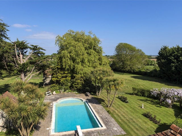 A central lawn has well-stocked herbaceous borders planted around the remains of the original castle layout where evidence of the drawbridge and castle apartments can be found.