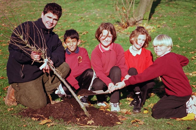 Adrian Burke Countryside Develpoment Officer helped plants a pear tree at the  Woodhouse West  school with pupils Ahmed Audhali, Karina Biggin, Dale Gibson and Dane Caley  in 1999.