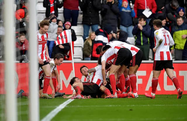 Sunderland players celebrate a recent goal.
