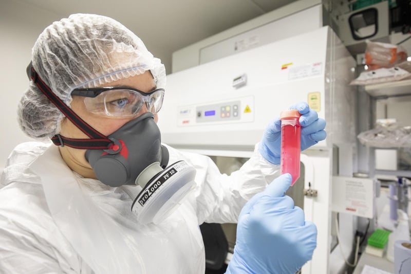 Dr Vanessa Herder handles a cell solution infected with SARS-CoV-2, the virus which causes COVID-19, which has been grown to determine the amount of virus, in the Richard Elliott Biosafety Laboratories (REBL), Containment Level 3 Facilities, at the MRC-University of Glasgow Centre for Virus Research.