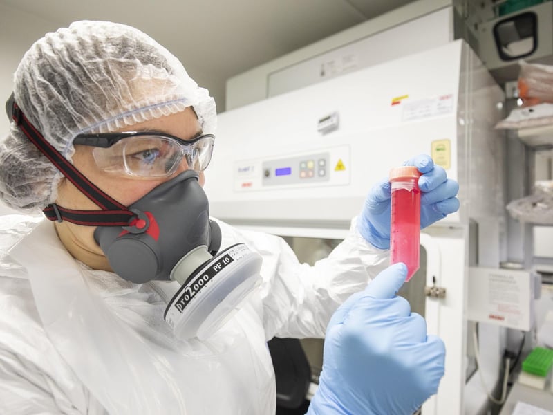 Dr Vanessa Herder handles a cell solution infected with SARS-CoV-2, the virus which causes COVID-19, which has been grown to determine the amount of virus, in the Richard Elliott Biosafety Laboratories (REBL), Containment Level 3 Facilities, at the MRC-University of Glasgow Centre for Virus Research.