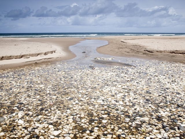 Located on County Antrim’s northern coastline, White Park Bay boasts three-miles of white sand, and is situated in a secluded spot on the Giant’s Causeway (Photo: Shutterstock)