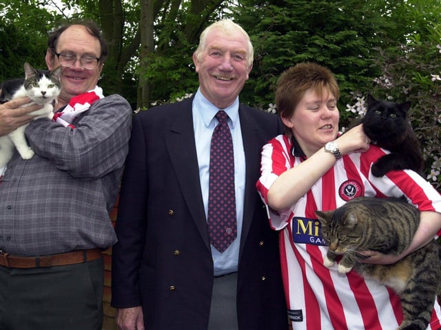 Derek Dooley with fans Reg and Susie Pantling with their cats named after Blades players, Tommy, Bobby and Bladey