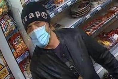 Pictured is an image released during a witness appeal by South Yorkshire Police of the armed robber who struck at the Doncaster Food and Wine store, on Beckett Road, Doncaster, on Decenber 14, 2021, before he subsequently gave himself up and was jailed.
