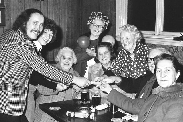 Paddy McGuigan (left), manager of the  Pallion Inn, and his wife, Margaret, were hard at work entertaining at this party in the pub in 1974.