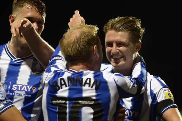 Sheffield Wednesday midfielder George Byers celebrateshis goal at Morecambe with skipper Barry Bannan.