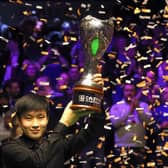 Zhao Xintong lifts the trophy after winning the final of the Cazoo UK Championship at the York Barbican. Photo: Richard Sellers/PA Wire.